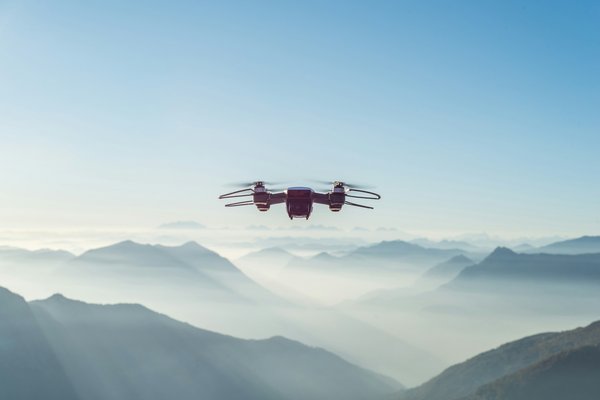How can a UK-based drone delivery service adhere to local airspace regulations and maintain safety standards?